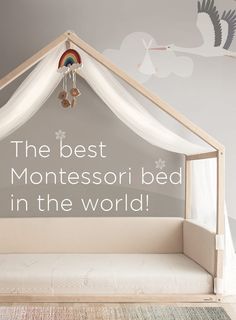 a bed with a canopy over it and the words, the best montessoi bed in the world