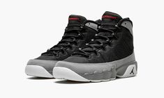 The Air Jordan 9 GS “Particle Grey” is the youth sizing for the simple yet striking take on a fan favorite Air Jordan model.  This Jordan 9 for kids features a black textile base with Particle Grey leather overlays and contrasting red accents for the branding areas on the heel and tongue.  A white rubber outsole completes the design. Air Jordan 9 Retro, Air Jordan Retro 13, Jordan Shoe, Jordan 9 Retro, Air Jordan 9, Jordan Model, Jordan 9, Jordan Shoes Retro, Fresh Shoes