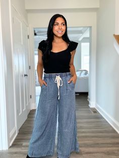 Enhance your fall wardrobe with our Mineral Wash Wide Leg Soft Denim Bottoms. Made with a mineral wash for a unique finish, these bottoms feature a drawstring elastic waistband for ultimate comfort and a versatile fall outfit option. Elevate your style with these high-quality, on-trend denim bottoms. mineral washed, soft cotton denim elastic waistband for an easy true to size fit wide straight leg bottom models are in sizes small (5’8 & 5’2) & large (5’1) These ship in 1-3 business days to pair with your favorite fall sweater or bodysuit! Trendy Cotton Bottoms With Pull-on Style, Relaxed Fit Wide Leg Jeans With Drawstring, Everyday Dark Wash Bottoms, Everyday Wide Leg Drawstring Pants, Everyday Wide Leg Pants With Drawstring, Chic Dark Wash Everyday Bottoms, Mid-rise Wide Leg Pants For Summer, Relaxed Wide Leg Jeans For Fall, High Rise Wide Leg Pants For Summer Everyday Wear