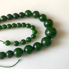 "6mm To 13mm Emerald Green Jade Round Beads Green Jade Smooth Round Beads 18 Inch Strand Jade Necklace, Jade Jewelry GDS1791. Gemstone: Jade Size(mm): 6-13mm Length(inch): 18\", 65pcs Aprox Weight: 190gms Approx Color: Green (Color Treated) Item Code: GDS1791 (Weight, Measurements and number of pieces are approximate) You can get Authenticity Certificate at an extra cost of $15.00 We guarantee that the raw diamonds we offer are conflict-free--we only source socially responsible diamonds. All Our Green Beaded Necklaces With 8mm Round Beads, Round Green Beaded Necklaces With 8mm Beads, Jade Beaded Necklaces With 8mm Round Beads, Jade Beaded Necklaces With 8mm Beads, Polished Jade Beaded Necklaces, Jade Necklaces With Large Round Beads, Jade Necklace With Spacer And Round Beads, Jade Necklace With Spacer Beads, Jade Beaded Necklaces With Round Beads