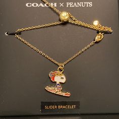 Brand New In Original Box And Never Worn Coach X Snoopy Sold Out Limited Edition Bracelet. Gold Toned Adjustable Sliding Bracelet With Winter Ready Snoopy! Cute Holiday Gift To Tuck Away Now! 9” L. Material Is Plated Brass. Smoke Free Home. Coach Adjustable Bracelet As Gift, Adjustable Coach Bracelets For Gift, Adjustable Coach Bracelets As Gift, Snoopy Cute, Initial Charm Bracelet, Slider Bracelet, Coach Jewelry, Enamel Bangle, Gold Sign