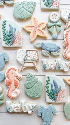 some decorated cookies are laying on a table