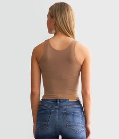 Free People Clean Lines Cropped Cami Tank Top - Brown M/L, Women's Strawberryroan Seamless high neck bust lined tank Bust measures 22 on size XS/S Body length 14 3/4 on size XS/S. 92% Nylon 8% Spandex. Machine wash cold gentle cycle. Non-chlorine bleach. Lay flat to dry.. Measurements: Bust -Fullest part of bust with arms at sides. Waist -Circumference of natural waist: above belly button below rib cage. Hips -Standing with feet together fullest part of hips. WOMEN'S TOP SIZE CONVERSION CHART Si Fitted Tank Vest With Built-in Bra, High Stretch Spring Camisole Tank Top, High Stretch Camisole Tank Top For Spring, Solid Color Tank Halter Top With Built-in Bra, Second-skin Camisole For Layering, Trendy Fitted Seamless Vest, Stretch Cami Halter Top Vest, Stretch Cami Halter Top With Vest Detail, Sleeveless Tops With Built-in Bra And High Stretch