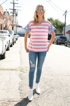 4TH OF JULY AMERICAN FLAG PRINT MIXED ROUND NECK SHORT SLEEVE TOP- MADE IN U.S.A. Style: CASUAL Print / Pattern: STRIPED Fit: REGULAR Neck Line: ROUND NECK Sleeve: SHORT SLEEVE Lining: NO Made In: Made In U.S.A Fabric Contents: 50% Polyester 38% Cotton 12% Rayon Non-sheer fabric Care Instructions: MACHINE WASH COLD, DO NOT BLEACH Sporty Flag Print Summer Tops, Spring Americana Short Sleeve T-shirt, Sporty Summer Tops With Flag Print, Casual Tops For 4th Of July With Relaxed Fit, Casual Cotton Tops For 4th Of July, Casual Relaxed Fit Tops For 4th Of July, Relaxed Fit Americana Tops For Summer, Summer Americana Style Relaxed Fit Tops, Red Patriotic Short Sleeve Tops