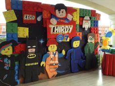 lego themed birthday party backdrop for a child's birthday with batman and superman characters