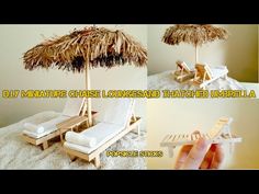 there is a miniature beach umbrella and chaise lounge set