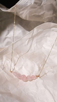 This beautiful and elegant Rose Quartz necklace - features the gentle and soothing gemstone that symbolizes the essences of unconditional love and a warm embrace. This bracelet is handcrafted with premium gold plated anti-tarnish brass wire. Designer grade A faceted rose quartz imported from Japan will dress up any outfit and its simple design allows it to be stackable with any other pairings! All pieces are made with lots of love! I hope that my creations can spark some joy into your hearts &lt Elegant Birthstone Necklaces For Healing, Elegant Birthstone Necklace For Healing, Minimalist Birthstone Necklace For Mother's Day, Dainty Crystal Necklace With Adjustable Chain For Healing, Minimalist Rose Gold Crystal Pendant Necklace, Minimalist Crystal Necklaces With Natural Stones, Elegant Rose Quartz Crystal Necklace In Rose Gold, Minimalist Rose Gold Crystal Necklace, Minimalist Crystal Necklace With Delicate Chain As Gift