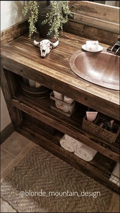 a bathroom vanity with a sink and mirror in the corner next to a rug on the floor