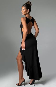 The Theodora maxi was made for special events, parties and late nights. Crafted in our premium double stretch crepe which moulds to your figure, this high neck dress features a super low back with delicate mesh panels and a double frill detail skirt. Wear yours with sleek, straight hair and silver jewellery. 



Colour: Black.

Premium stretch crepe.

Fully lined.

Moulds to body figure.

Double frill detail.

Thigh high split.

Super low back.

High neckline.

Mesh panels on back.

Invisible zi Sheer Back Stretch Maxi Dress For Party, Stretch Maxi Dress With Sheer Back For Party, Stretch Floor-length Backless Evening Dress, Elegant Stretch Maxi Dress With Ruched Back, Stretch Maxi Dress With Low Back For Night Out, Stretch Low Back Maxi Dress For Night Out, Formal Stretch Maxi Dress With Ruched Back, Stretch Floor-length Backless Dress For Evening, Evening Backless Midi Dress With Ruffles