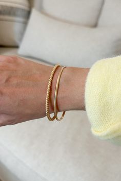 The Venice Cuff Bracelet in Gold is effortless and handcrafted in Utah. Featuring a twisted design, 14K gold filled material, and a substantial yet dainty look. This bracelet can be paired with any of our other dainty pieces for a layered look! Details & Sizing Gold color Handmade in Utah Twisted design Material 14K gold filled Care Instructions Will not wear off over time Not effected by exposure to moisture or water Tarnish resistant Shipping & Returns We offer free ground shipping on USA dome Gold Chain Bracelet, Gold Bracelet Chain, Sweater Set, Layered Look, Chain Bracelet, Gold Chain, Cuff Bracelet, Gold Chains, Venice