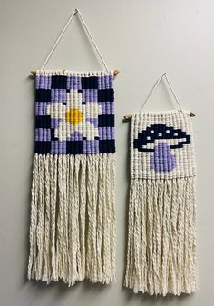 two woven wall hangings with flowers on them