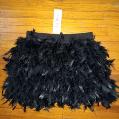 Black Feathered Mini Skirt Size Small Black Skirt For Costume Party In Spring, Black Skirt For Spring Costume Party, Black Bottoms For Costume Parties In Summer, Black Lined Skirt For Costume Party, Black Bottoms For Summer Costume Party, Black Party Bottoms With Feather Trim, Feather Skirt, Black Feathers, Mini Skirt