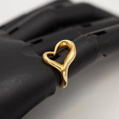 Preowned Tiffany & Co. Elsa Peretti Open Heart Ring crafted in 18k yellow gold  Ring Size: 5.75  Approximate Weight: Gross - 10.7 grams  Approximate Measurement: Ring Top 0.7" at widest  Hallmarks: 18k © Tiffany & Co. Peretti Open Heart Ring, Vintage Tiffany, Elsa Peretti, Ring Crafts, 18k Yellow Gold Ring, Open Heart, Yellow Gold Ring, Yellow Gold Rings, Tiffany & Co.