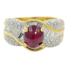 A ravishing, rich cherry red oval-cut ruby, weighing 2.48carats, radiates between of bright baguette diamonds and rows of smaller seamlessly-set further embellished on the sides with round brilliant-cut diamonds, in this classic high-quality estate jewel rendered in gleaming 18k yellow gold. Currently ring size 7.25. Stunning Diamond Rings, Statement Rings Diamond, Ruby Diamond Rings, Pave Diamond Ring, Baguette Diamonds, Diamonds Ring, Diamond Cocktail Rings, Gold Branding, Cherry Red