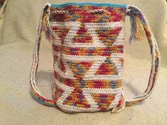 A nice sturdy handbag. Artistic flare and a functional item. Will keep your go to items secure while looking fun and stylish. A one of a kind bag made with love and care Artisan Multicolor Crochet Bag With Adjustable Strap, Handmade Multicolor Pouch Bucket Bag, Unique Handmade Shoulder Bag For Travel, Unique Multicolor Handwoven Bags, Unique Handwoven Bags For Everyday Use, Multicolor Crochet Bag With Weaving For Travel, Handwoven Multicolor Crochet Travel Bag, Multicolor Crochet Weaving Bag For Travel, Artsy Handmade Shoulder Bag For Everyday Use