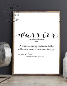 a poster with the words warrior on it next to a vase and potted plant