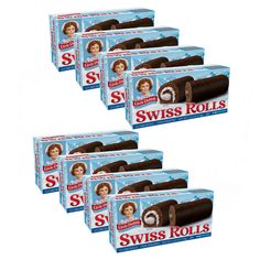 six boxes of swiss rolls with chocolate frosting on the top and one in the middle