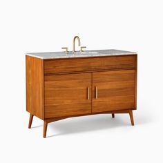 a wooden cabinet with a sink and faucet on it's side, against a white background