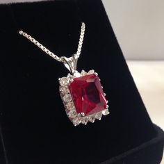 "Gorgeous Ruby & White Sapphire Cluster Pendant Necklace * 7ct Emerald Cut Ruby measures 12mm x 10 mm * 18 Brilliant Cut White Sapphire measure 2.5mm each * 8.5cts total gemstone weight * Solid Sterling Silver (also available in 14k White or Yellow Gold - message me for details and pricing) * 18\" Chain Included Hallmarked & Gift Ready! Matching Cluster Ring also Available! This Ruby is Laboratory Grown. It is identical to natural in every way, including Chemistry, Composition & Hard White Gold Ruby Necklace With Diamond Cut, Luxury Ruby Cluster Jewelry, Formal Ruby Necklace With Halo Setting, Dazzling Ruby Necklace With Diamond Cut, Ruby Cluster Jewelry With Halo Setting, Classic Ruby Necklace With Diamond Cut, Classic Ruby Necklaces For Formal Occasions, Formal White Gold Ruby Necklace, Ruby Pendant With Diamond Cut