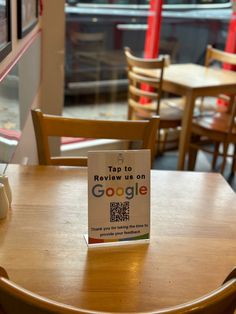 a table with a sign on it that says top 10 review us on the google