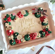 a decorated christmas cake sitting on top of a table