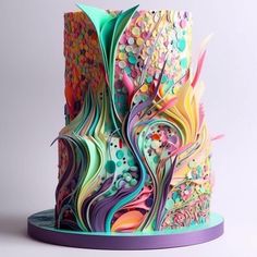 a multicolored cake with an intricate design on it's top and bottom