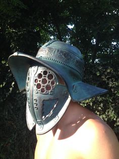 a man wearing a helmet with holes in it