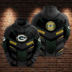 the green bay packers'black and gold uniform is shown on a brick wall with light behind it