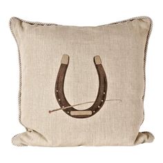 a pillow with a horse shoe on it