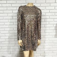 A Fun And Flirty Sequin Dress That Will Make You The Bell Of The Ball. With A Minimalist Silhouette To Truly Showcase This Special Sequin Fabric, Comprised Of Shining Paillettes In A Mix Of Silver And Gold. Long Sleeve Shimmer Mini Dress For Cocktail, Long Sleeve Shimmer Dress For Date Night, Sparkling Long Sleeve Dress For Date Night, Glamorous Long Sleeve Shimmer Dress, Metallic Long Sleeve Mini Dress For Cocktail, Long Sleeve Shimmer Dress For Spring, Silver Mini Dress For Fall, Long Sleeve Sparkling Cocktail Dress, Metallic Long Sleeve Mini Dress With Shimmer