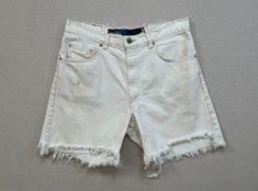 "1990's, Levi's, denim cut-off shorts in white.  There is no size labeled (Men's), so please refer to measurements for accurate sizing.  100% cotton.  Button waist with zip fly.  There are marks and they are very worn, see pictures. 17\" across waist 20.5\" across hips 12.25\" front rise 16.25\" back rise 6\" inseam 12\" across cuff" Pretty Hats, Levis Denim, Levi Shorts, Short En Jean, Cut Off Shorts, Chicago Il, Black Knit, Cropped Leggings, Jeans Shorts