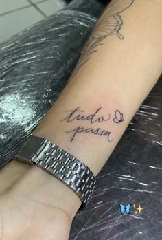 a person with a tattoo on their arm that says, taud and poun