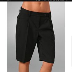 Black Bermuda Shorts Pleating And Slant Pockets At The Front, Flap Back Packets. Extended Tab, Single Closure Black Short Length Bottoms For Office, Elegant Black Shorts For Office, Elegant Black Office Shorts, Fitted Black Shorts For Business Casual, Black Bermuda Shorts, Maroon Shorts, Capri Shorts, Grey Flats, Beige Shorts