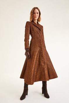 Our iconic Alabama Coat Dress silhouette takes inspiration from vintage hunting coats. Cut from a beautiful blended wool tweed with a soft metallic base intertwined with a beautiful copper brown thread. Fully lined in silk satin. The tailored bodice nips in the waist, featuring an open collar and a high back neck pitch. A flattering, fluid, part circular skirt with front pockets and a level hem. High ball self covered buttons add a beautiful feature as well as a secure fastening, giving you the Suzannah London, Circular Skirt, Hunt Coat, Vintage Hunting, London Boutique, Copper Brown, Copper Metal, Tweed Blazer, Dress Silhouette