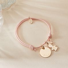 A reminder of your little ones to cherish wherever you go. Our Personalized Mommy Bracelet is a delicate symbol of love, perfect for a new mom celebrating the arrival of a little one, or as a thoughtful birthday gift. Each smooth disc charm can be hand engraved with the names of little ones or their date of birth, ready to pair alongside a girl or boy charm of their choice.18K Champagne Gold Plated, 925 Sterling Silver or 18K Rose Gold PlatedCharms measure: 0.6 x 0.6 (Small Flat Disc), 0.5 x 0.3 Personalized Pink Bracelet As Gift For Mom, Mother's Day Engraved Adjustable Name Bracelet, Mama And Mini Bracelets, New Mum Bracelet, Personalised Baby Bracelet, Heart Braid, Braids For Boys, Small Flat, Engraved Bracelet