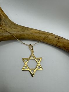 Vintage Star of David, Mogan David, Jewish Star 9k gold filled larger size about an inch  Lovely etched design Matching fine gold filled chain 16, 18, 20 or 22 inches  Thank you for supporting a small veteran owned business. All jewelry is shipped free within the US in a stylish gift box  PLEASE NOTE If we have multiples of the same vintage item, it is because we often purchase factory remnants or odd lots. Likewise, if you have a product to sell, please reach out! Thank you, Tom Engraved Star-shaped Yellow Gold Necklace, Gold Engraved Star Of David Necklace, Engraved Star Yellow Gold Necklace, Hallmarked 14k Gold Star Of David Jewelry, 14k Gold Star Of David Jewelry, Gold Star Of David Necklace In 14k Gold, 14k Gold Star Of David Necklace Engraved, 14k Yellow Gold Star Of David Necklace, 14k Gold Star Of David Necklace For Anniversary