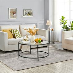 a living room filled with furniture and a table on top of a carpeted floor