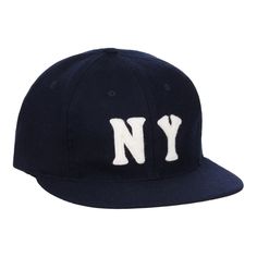 Description: Authentic reproduction of the original 1936 New York Black Yankees ballcap. Hand-sewn from genuine wool baseball cloth. Product Details: Made in the USA Genuine navy wool broadcloth, white felt "NY" Standard visor with green satin under visor Vintage hair cloth backed buckram crown Satin taping with cotton Yankees Cap, Minor League Baseball, Felt Letters, Hockey Shirts, Protective Clothing, National League, Vintage Hair, Green Satin, Hat Pins