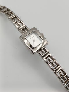 This elegant Sekonda watch features a vintage square dial design and a sleek silver tone, giving it a dainty and timeless look. With its refined style and reliable timekeeping, this watch is the perfect accessory for any occasion. Expertly crafted for durability and precision, it is sure to become a staple in your wardrobe. Fitted with a new battery, in working order.  Has minor wear, please see pictures.  Length: 18cm. Dial width: 1.7cm Pricing depends on uniqueness of the watch, brand name, co Silver Square Watch With Metal Dial, Elegant Silver Watch With Square Face, Timeless Silver Square Watch, Elegant Silver Square Watch, Silver Watches Women Classy, Dainty Silver Watch, Vintage Silver Watch, Sekonda Watch, Silver Watches