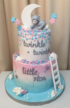 a birthday cake with a monkey sitting on top of it and stars in the sky