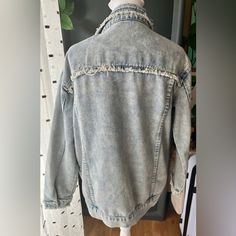 New Without Tag Over Size Distress Denim Jacket. Measurements From Shoulder Across Is 19 Inches From Shoulder To Bottom 23 Inches Long, Arms From Shoulder Down Is 22 Inches In Length. Trendy Light Wash Denim Top With Frayed Hem, Acid Wash Denim Top, Blue Denim Jacket With Frayed Hem And Relaxed Fit, Dark Wash Denim Top With Frayed Hem, Casual Acid Wash Denim Top, Trendy Washed Denim Top, Relaxed Fit Light Wash Denim Jacket With Frayed Hem, Denim Outerwear With Frayed Hem In Washed Blue, Washed Blue Denim Outerwear With Frayed Hem