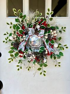 a christmas wreath hanging on the front door