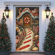 a christmas door cover with candy canes on the ground and trees in front of it