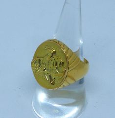 Piscatorius ring in solid yellow gold plated sterling silver. The top measures 0.90 inches tall by 0.68 inches wide This ring has a solid smooth back and weights 22 grams (0.88 oz) It comes with a velvet pouch and a shopper Anello Di San Pietro Pescatore in argento dorato 925 millesimi. L'ovale misura 23 mm x 17,50 Gold 14k Signet Ring With Intaglio, Gold 14k Intaglio Signet Ring, Symbolic Gold Intaglio Jewelry, Symbolic Yellow Gold Brass Rings, Formal Yellow Gold Brass Signet Ring, Gold Signet Ring With Intaglio For Gift, Gold Signet Ring With Intaglio As A Gift, Gold Intaglio Signet Ring Gift, Hallmarked Yellow Gold Rings In Brass