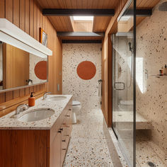 A mid-century modern bathroom featuring a harmonious mix of terrazzo tiles, stainless steel, and warm wood accents, creating a tactile and visually appealing space3 Mcm Shower Tile, Mid Century Toilet Design, Mid Century Interior Bathroom, Coastal Mid Century Modern Bathroom, Bathroom Remodel Master Modern, Midmod Bathroom, Master Modern Bathroom, Mobile Home Bathroom Remodel Master Bath, Ensuite Bathroom Ideas Master Bedrooms