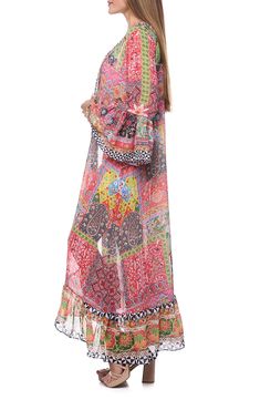 Go from beach to boardwalk in this sun-ready cover-up duster that's secured with a front tie and rendered in a bright print. Open front Shawl collar Long sleeves 100% polyester Hand wash, dry flat Imported Bohemian Multicolor Printed Cover-up, Multicolor Flowy Cover-up For Beach Party, Flowy Multicolor Beachwear Cover-up, Multicolor Long Sleeve Cover-up For Beach Party, Multicolor Printed Kimono For Beach Cover-up, Multicolor Beachwear Kimono For Beach Party, Multicolor Beachwear Cover-up For Festival, Vibrant Multicolor Kimono For Vacation, Multicolor Festival Beachwear Cover-up