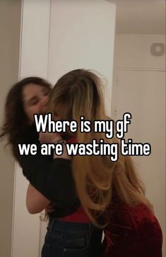 two women hugging each other in front of a mirror with the words where is my gf