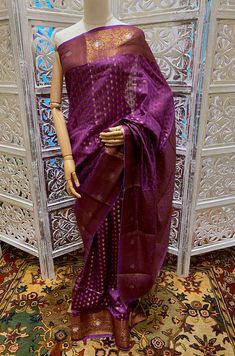 A High Quality Beautiful Magenta Color Handloom Pure Dupion Silk Banarasi Saree with Antique gold Zari Jaal Brocade all over. The entire saree has delicate Gold zari work. It has a gold Zari border and heavy brocade Pallu. A classic traditional Banarasi saree for all wedding celebrations. The saree comes with unstitch attached blouse. In comparison to other silk fabrics, dupion silk fabric is a bit strong because of its dual thread nature. In addition to being the most durable natural fabric, du Traditional Purple Tissue Silk Pre-draped Saree, Purple Self-design Pre-draped Saree For Puja, Purple Handloom Pre-draped Saree For Puja, Bollywood Style Purple Handloom Pre-draped Saree, Purple Handloom Pre-draped Saree For Diwali, Purple Paithani Silk Pre-draped Saree For Wedding, Traditional Purple Pre-draped Saree For Navratri, Traditional Purple Pre-draped Saree For Puja, Festive Handloom Pre-draped Saree For Puja