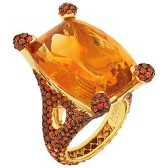 Citrine 33.27 Carat Orange Sapphires 18 Karat Yellow Gold Ring Highlighting a 33.27 Carat Citrine and 358 Orange Sapphires weighing 7.72 Carats are mounted on an 18 Karat Gold lined with black rhodium. It displays a riveting interplay of contrast surfaces with the finest gemstones. Delicate color combination enchants with its harmonious. Ring can be purchased together with Earrings LU1164111974632. Size US 7 3/4 // Size EU 55 7/8 23.90 x 30.70 mm (WxH) Ring weight - 20.58 gm Citrine Rings, Dome Rings, Orange Ring, Colored Stone Rings, Gold For Sale, Sparkle Jewelry, Orange Sapphire, Citrine Ring, Colored Gems