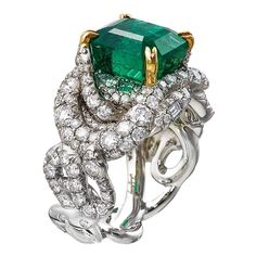 With this unique Emerald ring you will never be overdressed and still it will never be an Understatement. The unique Zambian Emerald with an octagonal shape step cut is amazingly beautiful, having an old mine columbian colour to it. The GIA certified stone weighs 5.49 ct. and is handcrafted to perfection in Platinum 950, 18K Yellow Gold and microscope-set 2.37ct./184pcs. white diamonds in F colour and VVS clarity. The AENEA Sarpa design, makes that ring easy to wear, without taking away the possibility to bling it with a fantastic evening dress. This Ring comes with a GIA Certificate. All Diamonds are tested natural Stones. Zambian Emerald (minor treatment/oil): 5.49Cts/1Pcs White Diamonds:2.37Cts/184Pcs F/VVS Platinum 950 Ring Size: 53 European For further information please contact us! V Gold Antique Engagement Rings, Fish Ring, White Diamond Rings Engagement, Contemporary Engagement Rings, Platinum Diamond Engagement Rings, Platinum Diamond Rings, Modern Engagement Rings, White Diamond Ring, Best Engagement Rings